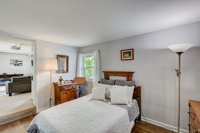 627 Beaver Rd, Glenview, IL 60025 - bedroom with baseboards and dark wood-type flooring