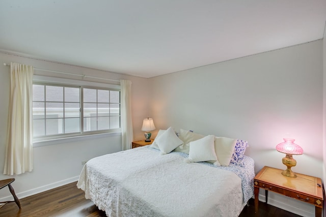 627 Beaver Rd, Glenview, IL 60025 - bedroom with baseboards and dark wood finished floors
