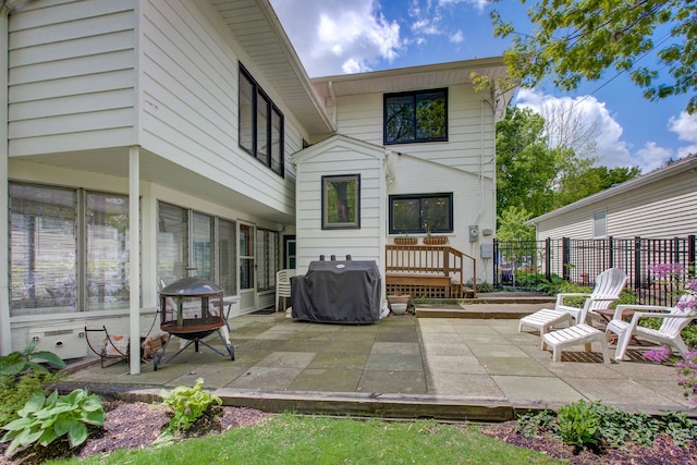 627 Beaver Rd, Glenview, IL 60025 - rear view of property featuring fence and a patio
