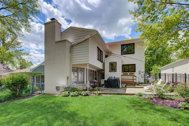 627 Beaver Rd, Glenview, IL 60025 - back of house featuring a yard, a patio, fence, and a chimney