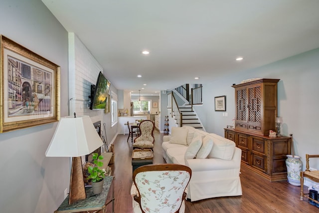 627 Beaver Rd, Glenview, IL 60025 - living area featuring recessed lighting, a large fireplace, stairs, and wood finished floors