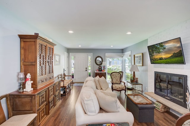 627 Beaver Rd, Glenview, IL 60025 - living room featuring a brick fireplace, recessed lighting, and wood finished floors