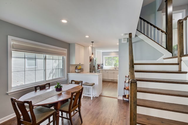 627 Beaver Rd, Glenview, IL 60025 - dining space with recessed lighting, wood finished floors, and stairway