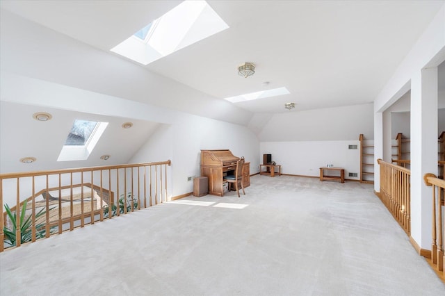 bonus room with lofted ceiling with skylight, carpet flooring, baseboards, and visible vents