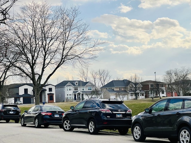 view of parking / parking lot with a residential view