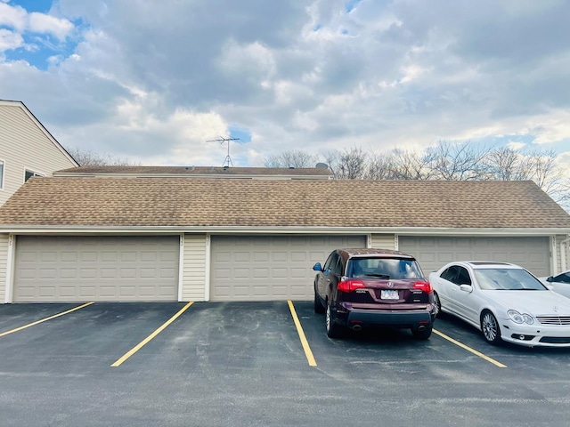 view of car parking with community garages