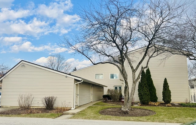 view of property exterior with a yard
