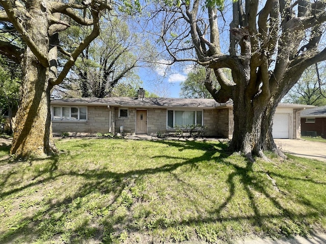 ranch-style home with a chimney, a front lawn, stone siding, and a garage