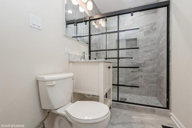 full bath featuring a shower stall, toilet, baseboards, and vanity