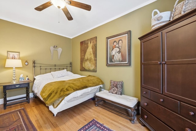 725 Erie St Unit 1D, Oak Park, IL 60302 - bedroom with crown molding, light wood finished floors, and ceiling fan