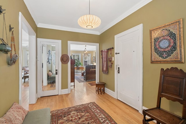 725 Erie St Unit 1D, Oak Park, IL 60302 - foyer with light wood-style floors, ornamental molding, baseboards, and a chandelier