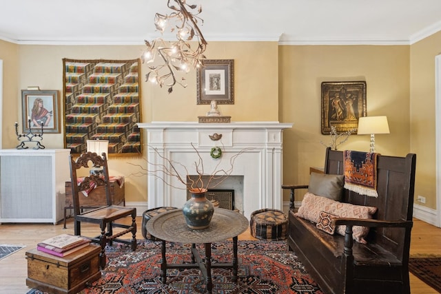 725 Erie St Unit 1D, Oak Park, IL 60302 - living area with wood finished floors, ornamental molding, baseboards, a fireplace, and a chandelier