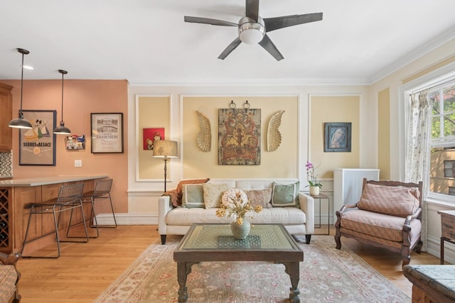 725 Erie St Unit 1D, Oak Park, IL 60302 - living area featuring light wood-type flooring, ceiling fan, ornamental molding, and baseboards