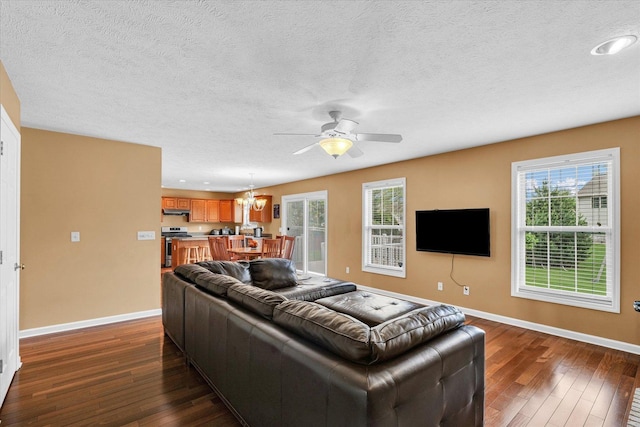 4603 Stonebridge Dr, Champaign, IL 61822 - living room featuring baseboards, a textured ceiling, dark wood-style floors, and ceiling fan with notable chandelier