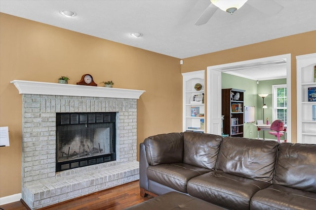 4603 Stonebridge Dr, Champaign, IL 61822 - living room featuring a brick fireplace, a ceiling fan, and wood finished floors