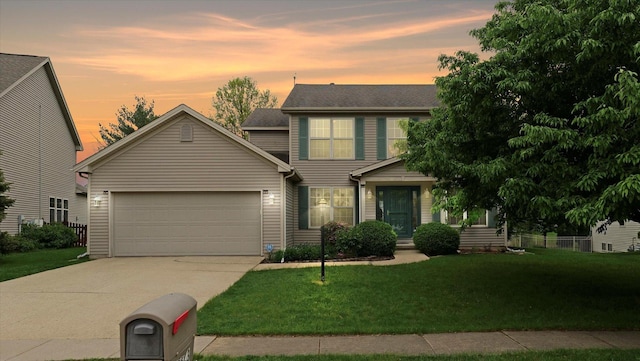 4603 Stonebridge Dr, Champaign, IL 61822 - view of front of home featuring a lawn, driveway, and a garage
