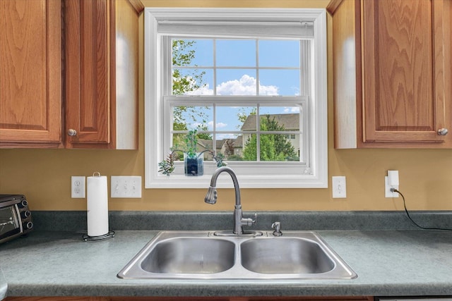 4603 Stonebridge Dr, Champaign, IL 61822 - kitchen featuring brown cabinets and a sink