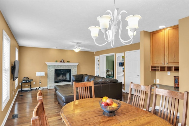 4603 Stonebridge Dr, Champaign, IL 61822 - dining room with ceiling fan with notable chandelier, baseboards, plenty of natural light, and wood finished floors