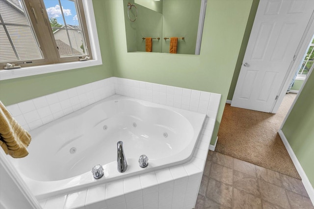 4603 Stonebridge Dr, Champaign, IL 61822 - bathroom featuring a jetted tub and baseboards