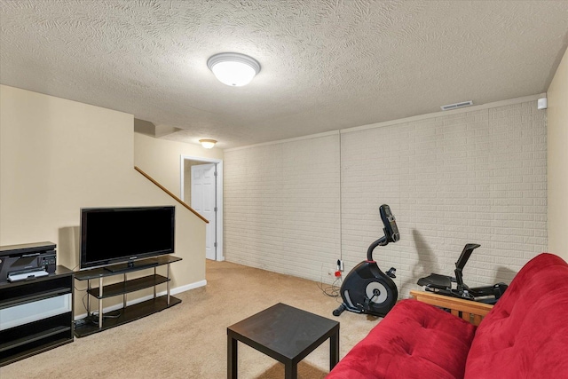 4603 Stonebridge Dr, Champaign, IL 61822 - living room featuring a textured ceiling, brick wall, visible vents, and carpet floors