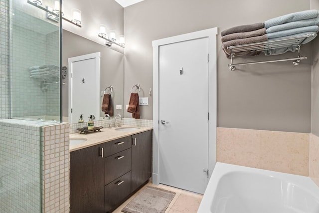 2112 W Belmont Ave Unit 1, Chicago, IL 60618 - bathroom featuring a tile shower, a sink, double vanity, tile patterned floors, and a bath