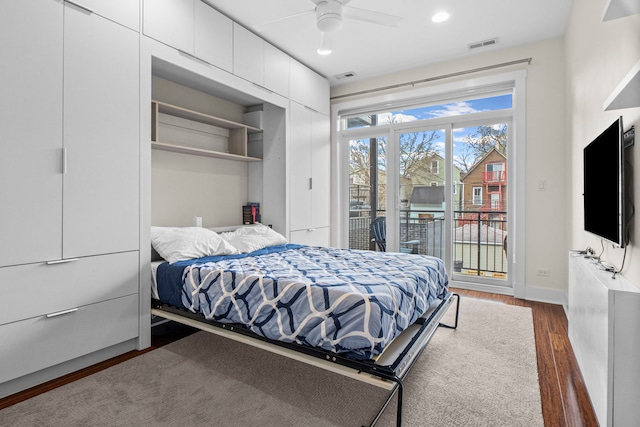 2112 W Belmont Ave Unit 1, Chicago, IL 60618 - bedroom featuring dark wood-style flooring, access to outside, baseboards, and visible vents
