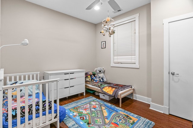 2112 W Belmont Ave Unit 1, Chicago, IL 60618 - bedroom featuring ceiling fan, baseboards, visible vents, and wood finished floors