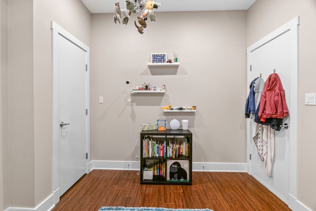 2112 W Belmont Ave Unit 1, Chicago, IL 60618 - entrance foyer with baseboards, a chandelier, and wood finished floors
