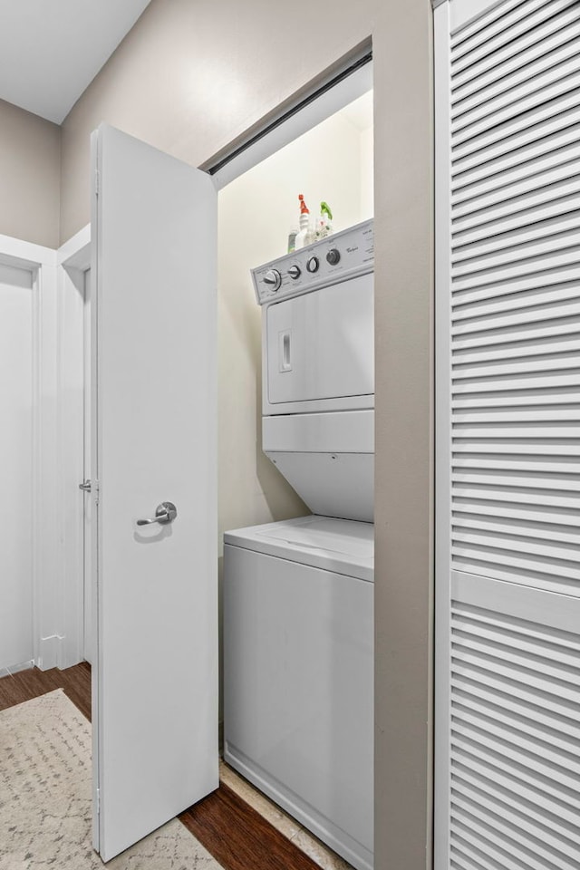 2112 W Belmont Ave Unit 1, Chicago, IL 60618 - laundry room with laundry area, stacked washer / dryer, and wood finished floors