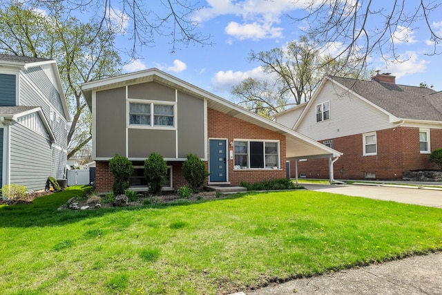 view of front of home featuring a carport, concrete driveway, a front lawn, and brick siding