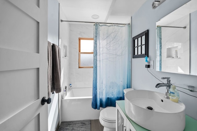 bathroom with vanity, toilet, and shower / tub combo