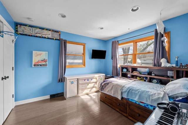 bedroom featuring recessed lighting, baseboards, and wood finished floors