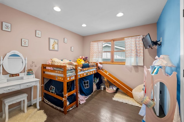 bedroom with recessed lighting, baseboards, and wood finished floors