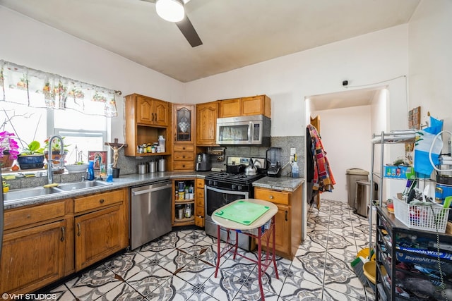 3610 Lombard Ave, Berwyn, IL 60402 - kitchen featuring appliances with stainless steel finishes, a sink, a ceiling fan, and brown cabinetry