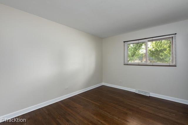 838 S Michigan Ave, Addison, IL 60101 - spare room with baseboards and dark wood-type flooring