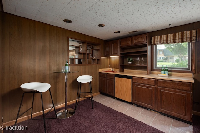 838 S Michigan Ave, Addison, IL 60101 - bar with dishwasher, wooden walls, light tile patterned floors, and light carpet