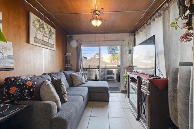 living room with light tile patterned flooring and wood ceiling