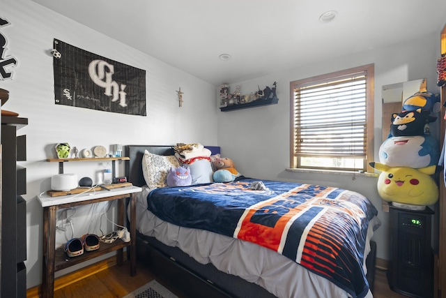 bedroom featuring wood finished floors