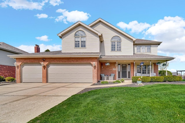 1075 Grand Mesa Ave, New Lenox, IL 60451 - traditional home featuring brick siding, a front lawn, a porch, and concrete driveway