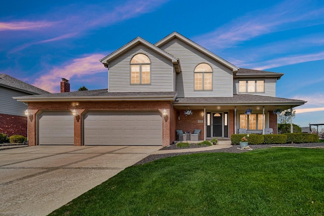 1075 Grand Mesa Ave, New Lenox, IL 60451 - traditional-style home with a lawn, a porch, driveway, and brick siding