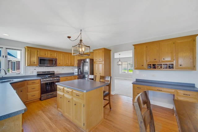1075 Grand Mesa Ave, New Lenox, IL 60451 - kitchen featuring light wood-type flooring, a sink, appliances with stainless steel finishes, and dark countertops