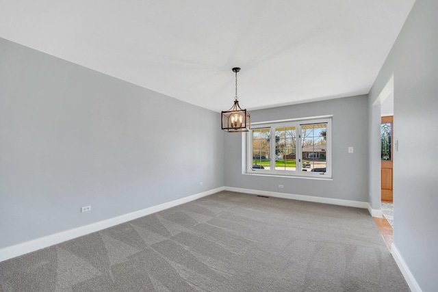 1075 Grand Mesa Ave, New Lenox, IL 60451 - spare room with baseboards, visible vents, carpet flooring, and a chandelier