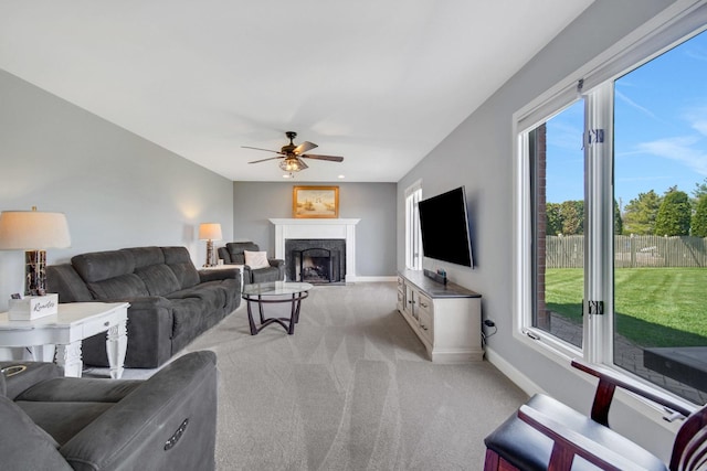 1075 Grand Mesa Ave, New Lenox, IL 60451 - living room featuring baseboards, light carpet, a ceiling fan, and a premium fireplace