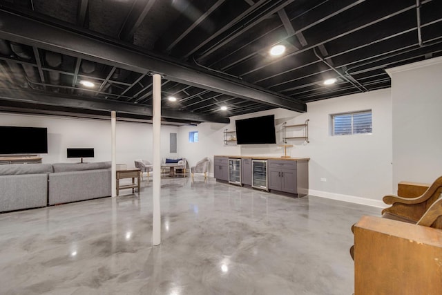 1075 Grand Mesa Ave, New Lenox, IL 60451 - living area featuring baseboards, bar area, concrete floors, and wine cooler