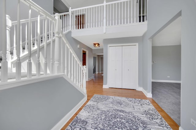 1075 Grand Mesa Ave, New Lenox, IL 60451 - entrance foyer with stairway, baseboards, wood finished floors, and a towering ceiling