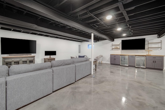 1075 Grand Mesa Ave, New Lenox, IL 60451 - living area with baseboards, bar, finished concrete floors, and wine cooler