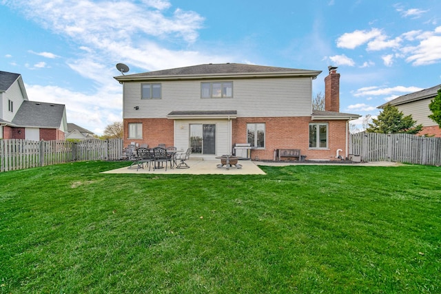 1075 Grand Mesa Ave, New Lenox, IL 60451 - back of house featuring a fenced backyard, a yard, a patio area, and brick siding