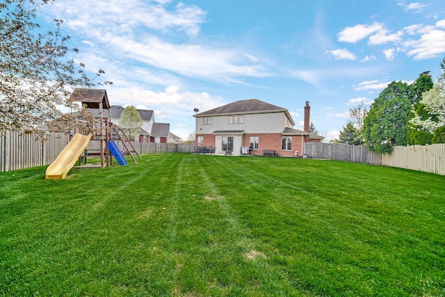 1075 Grand Mesa Ave, New Lenox, IL 60451 - view of yard with a fenced backyard and a playground