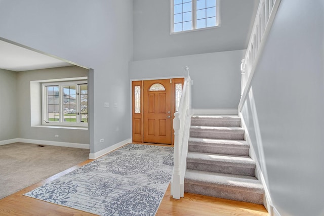 1075 Grand Mesa Ave, New Lenox, IL 60451 - entryway with visible vents, wood finished floors, baseboards, a high ceiling, and stairway