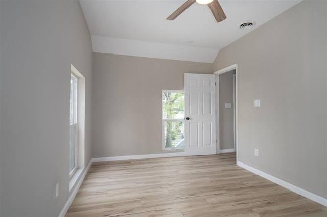 510 E Washington St, Pontiac, IL 61764 - empty room with light wood-style floors, ceiling fan, visible vents, vaulted ceiling, and baseboards
